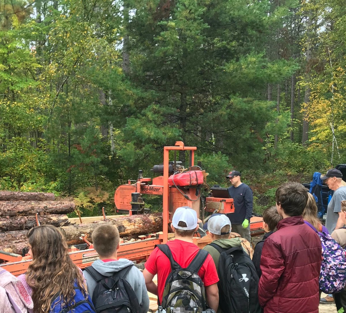 students learning how a sawmill works
